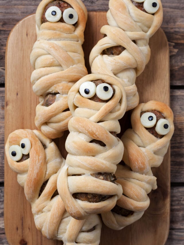 Easy Halloween Hot Dog Mummy Recipe; two ingredient mummy dogs using crescent dough and hot dogs. Easy fun Halloween recipe for kids!