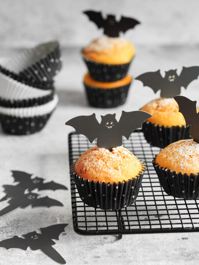 Halloween Bat Pumpkin Muffins; a cute festive halloween muffin recipe with cardboard bat top. Spooky halloween muffins!