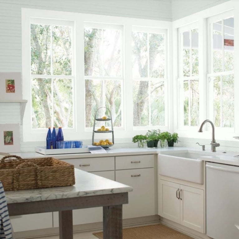 Kitchen with Benjamin Moore Quiet Moments Paint Color: pale blue paint color inspiration for a tranquil and serene room.