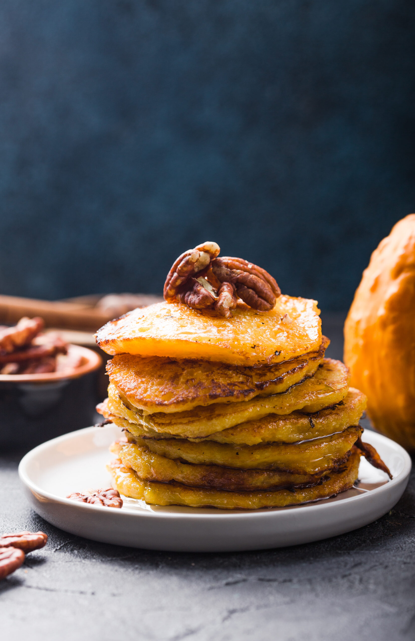 Easy Pecan Pumpkin Pancake Recipe; A delicious twist on your traditional pumpkin pancake recipe, with a sweet and salty pecan kick.