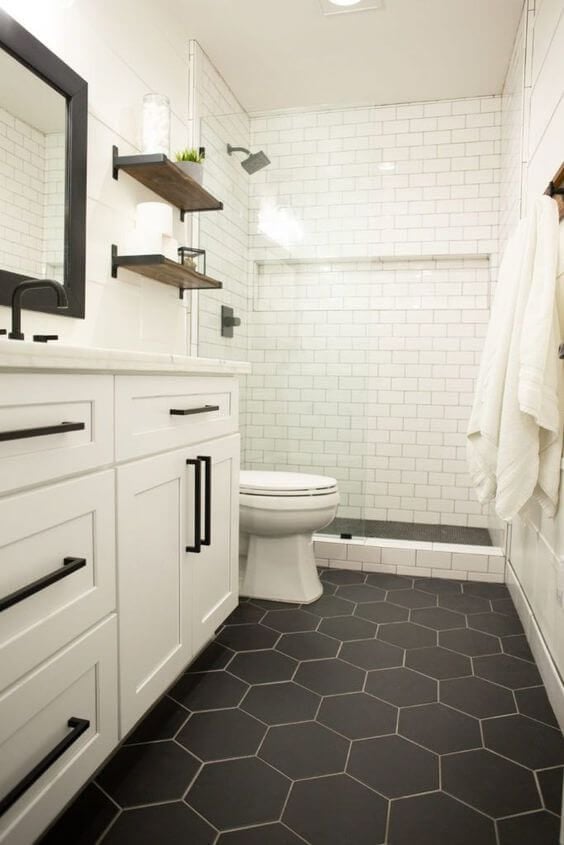 20 BEST Modern Farmhouse Flooring Ideas; black hexagon tile in bathroom