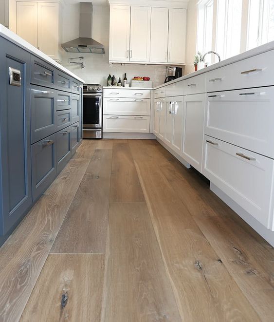 20 BEST Modern Farmhouse Flooring Ideas; Sawyer Mason's Madaket engineered wood flooring features tones of brown and grey complimenting the contemporary features of this unique floor.