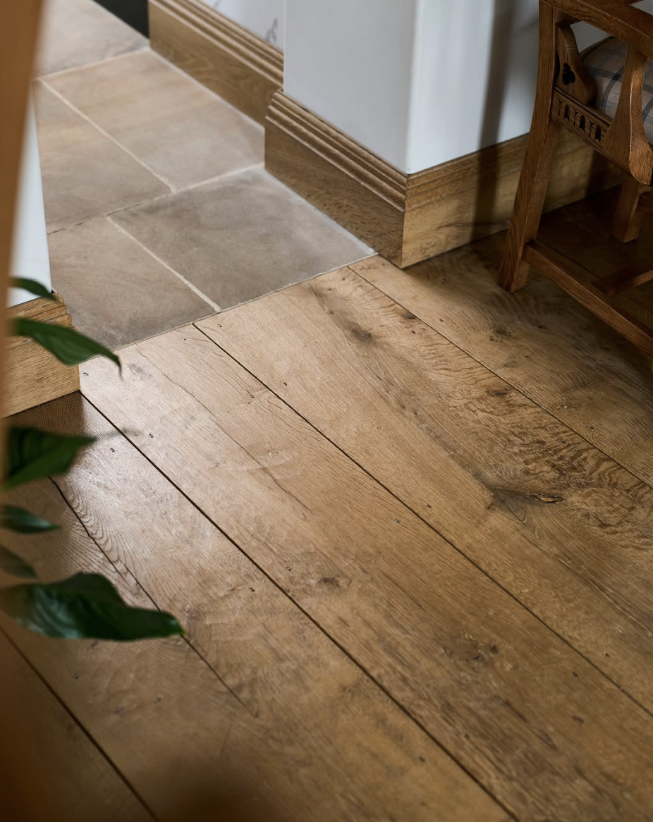 farmhouse flooring transition between wood planks and stone tile