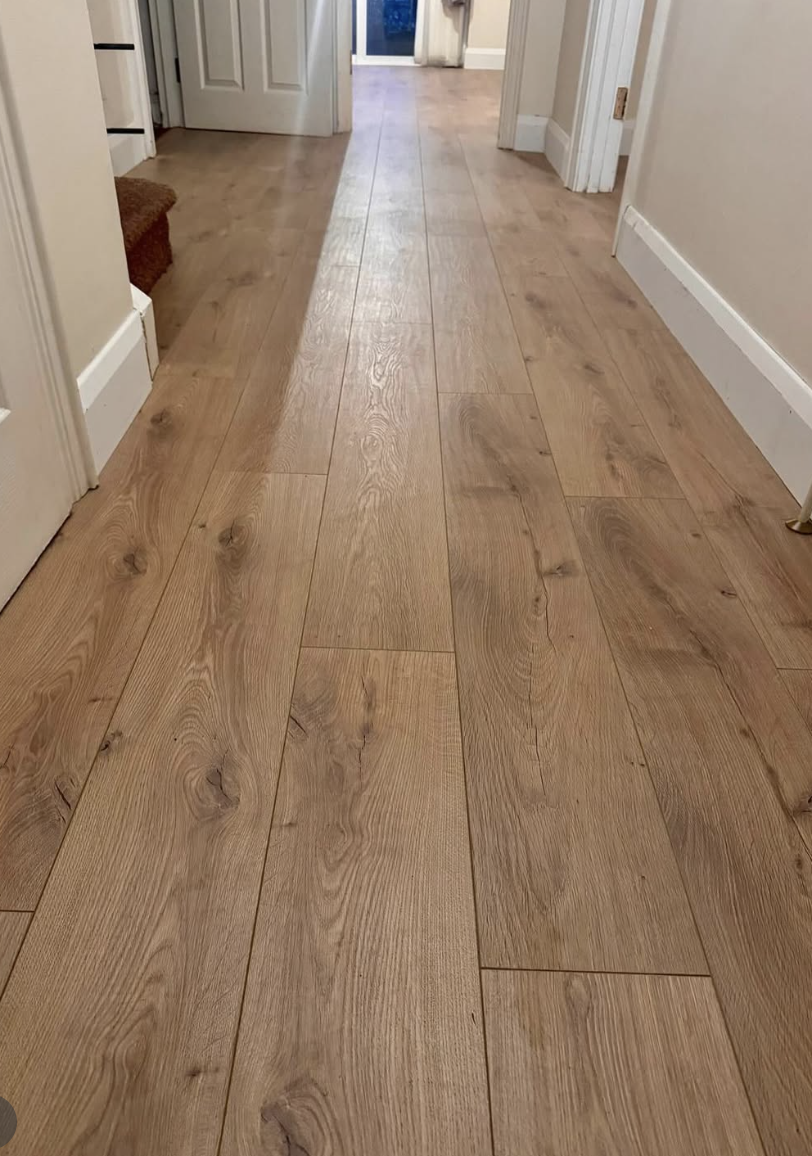 wide plank oak flooring in farmhouse hallway with natural wood grain detail