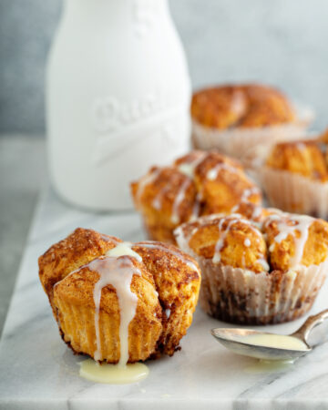 Cinnamon Monkey Bread Muffins Recipe; these sweet and fluffy pull apart muffins, bursting with cinnamon flavors will be one your family asks for every holiday season!