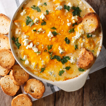 Cheesy Buffalo Chicken Dip Recipe; A delicious appetizer for parties and family get togethers. Every Super Bowl party needs a big pot of this creamy and spicy buffalo chicken dip.