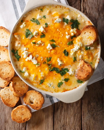 Cheesy Buffalo Chicken Dip Recipe; A delicious appetizer for parties and family get togethers. Every Super Bowl party needs a big pot of this creamy and spicy buffalo chicken dip.