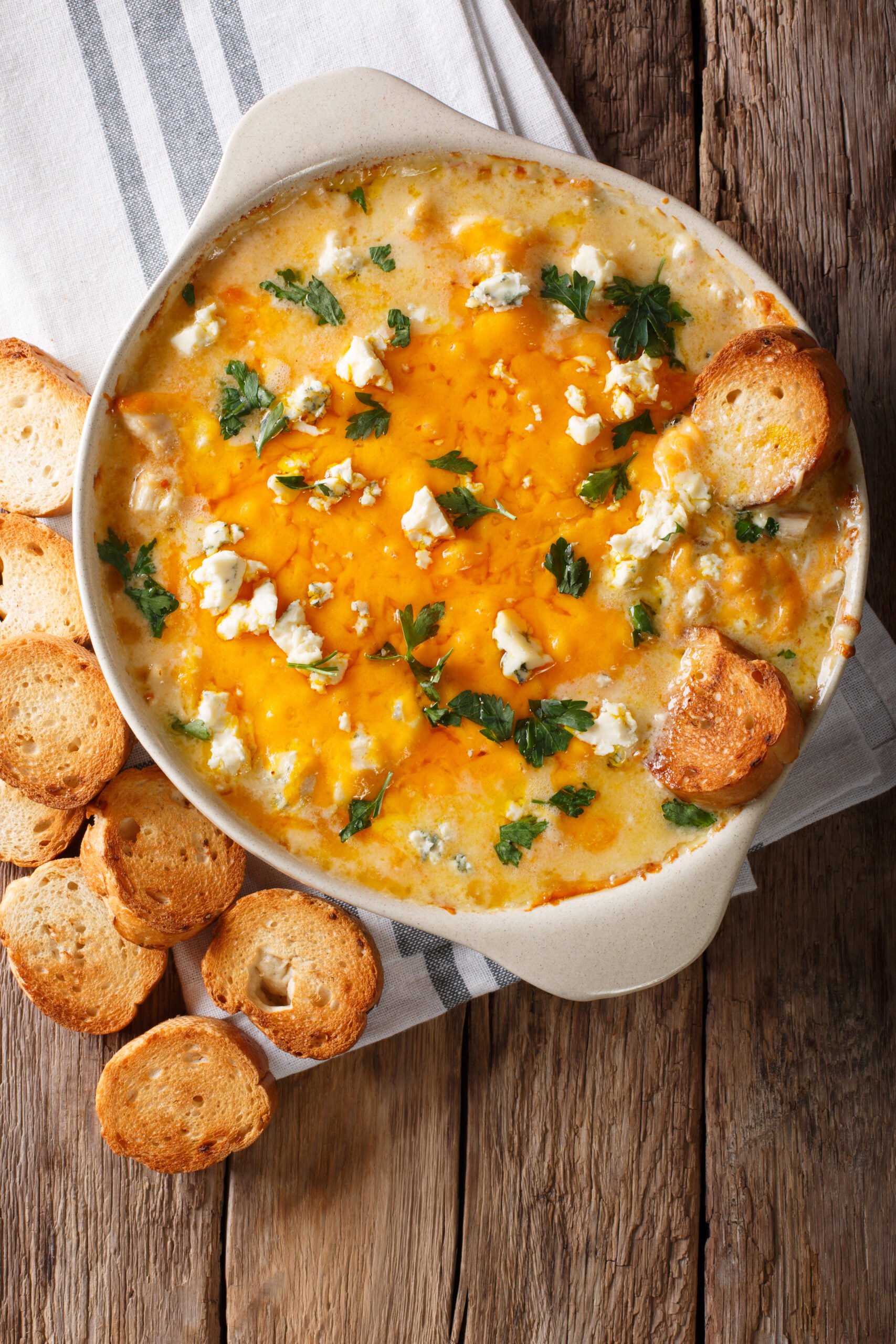 Cheesy Buffalo Chicken Dip Recipe; A delicious appetizer for parties and family get togethers. Every Super Bowl party needs a big pot of this creamy and spicy buffalo chicken dip.