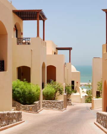 Sunset over a lake at The Arabic style villas at luxury hotel, Dubai, UAE. Emirates Hills in Dubai in the United Arab Emirates. Interior and Exterior of the Most Beautiful Villas in Dubai 