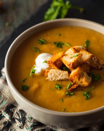 Easy Butternut Squash Soup Recipe; this creamy soup recipe is perfect for any cold day! Vegan and dairy free! Serve with bread for the ultimate experience.