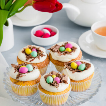 Easter Birds' Nest Vanilla Cupcakes Recipe; a fun Easter dessert recipe. Delicious fluffy vanilla cupcakes topped with Cadbury mini eggs and shaved chocolate!