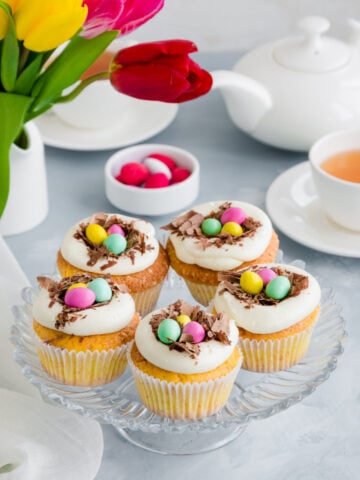 Easter Birds' Nest Vanilla Cupcakes Recipe; a fun Easter dessert recipe. Delicious fluffy vanilla cupcakes topped with Cadbury mini eggs and shaved chocolate!