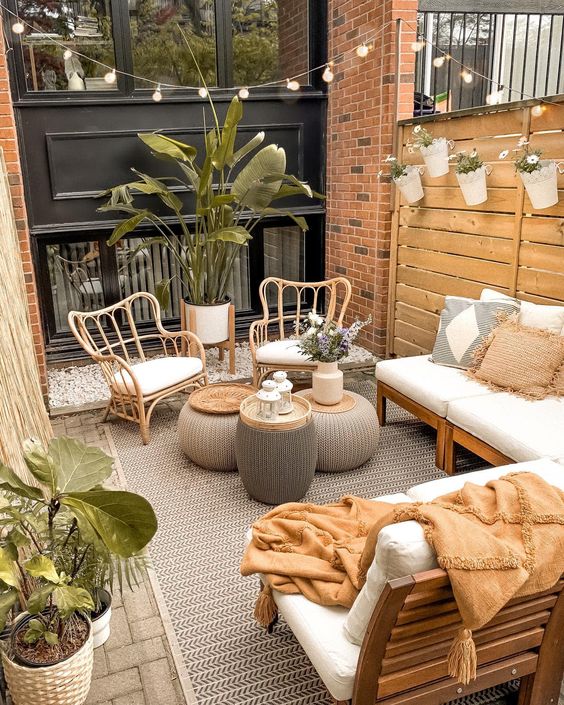 Boho Patio Furniture Ideas; The boho patio furniture ideas in this post include eclectic patio chairs, wall decor with rustic appeal, and even boho metal planters for your garden!