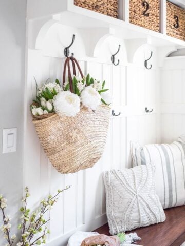 How to Decorate Your Entryway for Spring; Warm weather is on the way, and with it all the potential for beautiful flowers & bright colors. Here's how to bring springtime to your front door