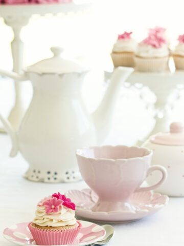 Afternoon tea served with gourmet cupcakes - Hosting the perfect Afternoon Tea Party? We have shared our expert tips to help you plan and organize a lovely gathering.