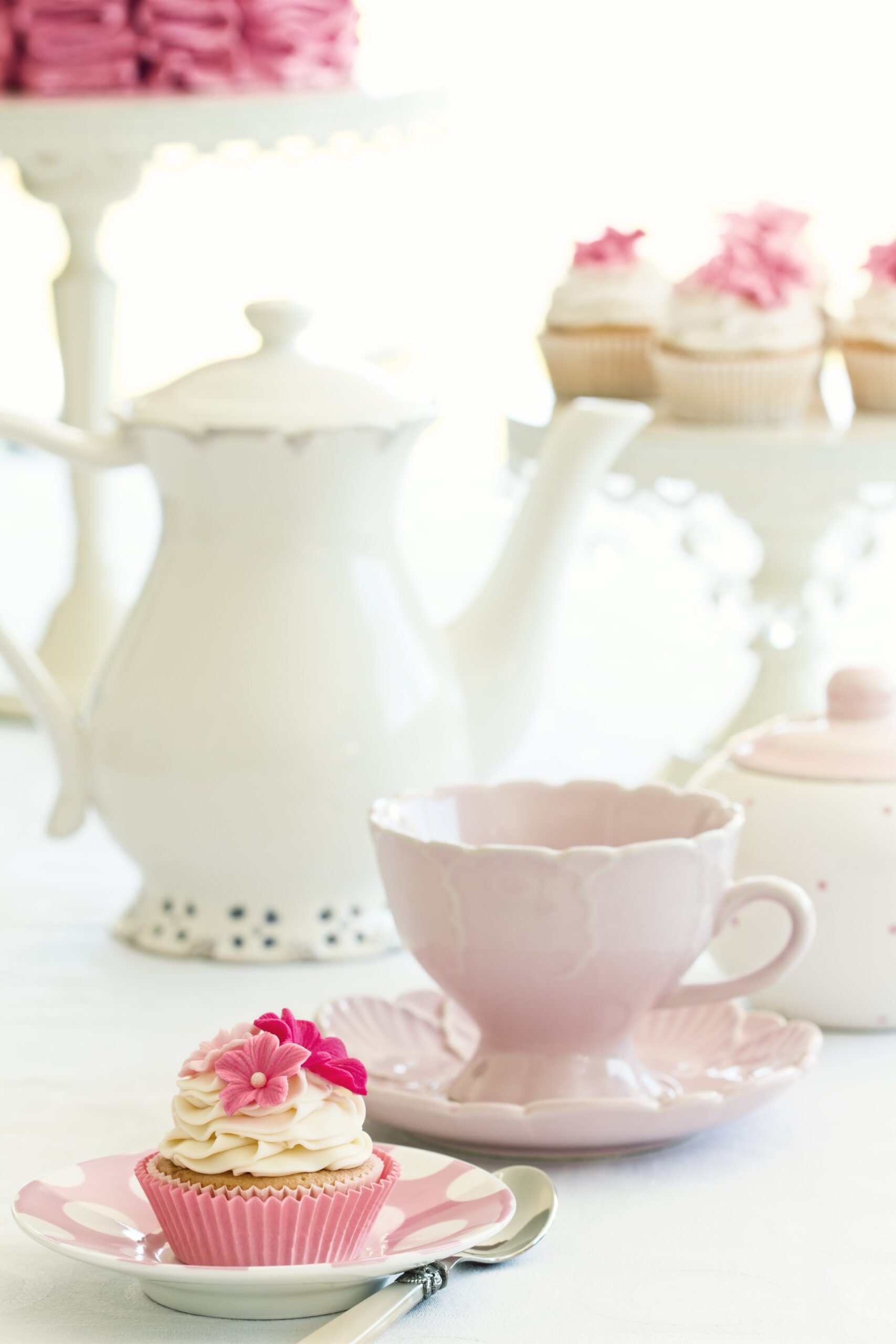 Afternoon tea served with gourmet cupcakes - Hosting the perfect Afternoon Tea Party? We have shared our expert tips to help you plan and organize a lovely gathering.