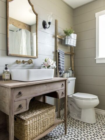 How to Create A Perfect Farmhouse Bathroom; antique vanity, green shiplap walls