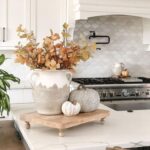 Fall Kitchen Decor Must Haves; Get ready for fall with my list of 10 must have kitchen decor items for 2023! From seasonal tablecloths to fall kitchenware and fall-scented soaps, these items will transform your kitchen into a warm and inviting space perfect for enjoying the season.Fall Kitchen Decor Must Haves; Get ready for fall with my list of 10 must have kitchen decor items for 2023! From seasonal tablecloths to fall kitchenware and fall-scented soaps, these items will transform your kitchen into a warm and inviting space perfect for enjoying the season.