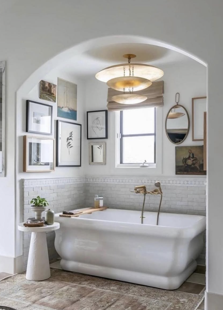 Spa-inspired freestanding soaking tub with brass fixtures and soft lighting showcasing bathroom trends for 2026 with a calm, luxury retreat design