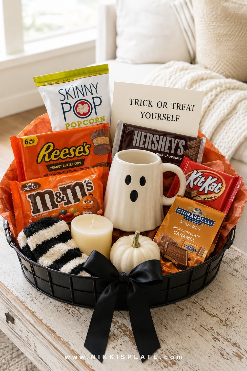 Halloween candy boo basket for women with Reese's, Hershey's, M&M's, KitKat, popcorn and a ghost mug.