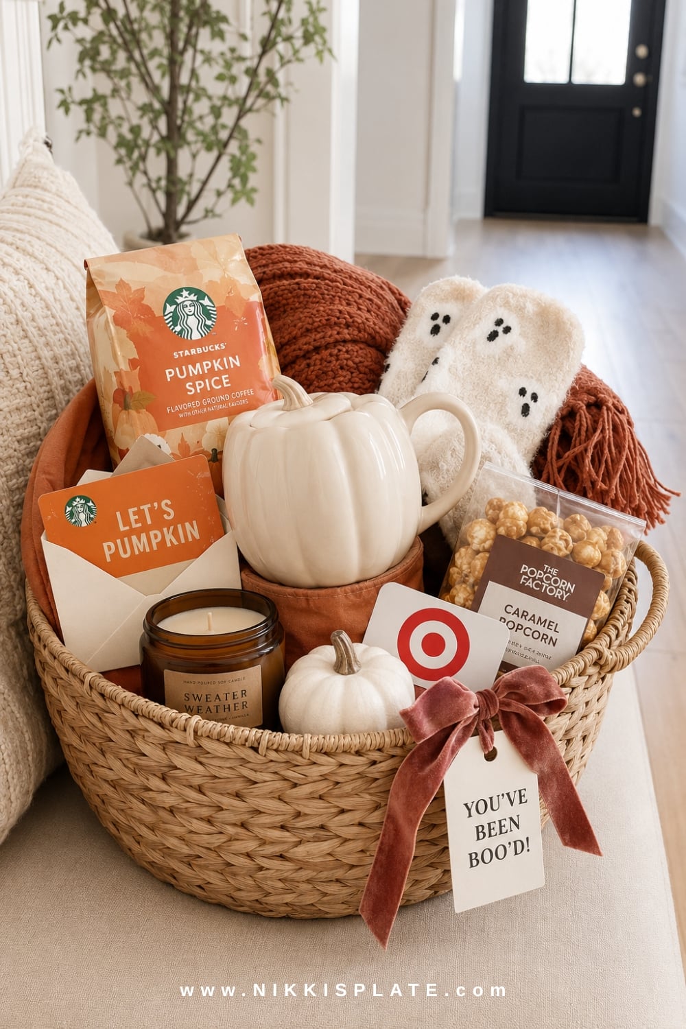 Starbucks and Target fall boo basket with a pumpkin mug, coffee, gift cards, fuzzy ghost socks and a cozy throw.