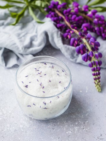 Learn how to make a DIY lavender salt scrub with this easy recipe using natural ingredients. Exfoliate, moisturize, and relax with this soothing homemade skincare essential!