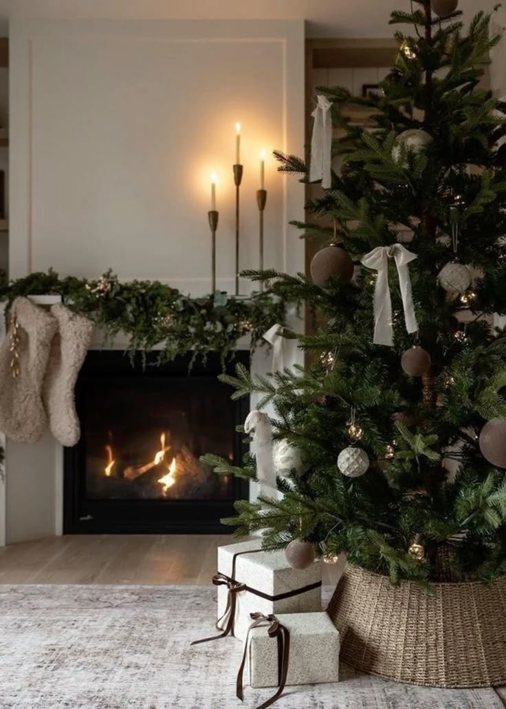 Christmas tree with a rustic woven tree collar, neutral ornaments, and warm holiday lighting next to a fireplace for cozy farmhouse decor.