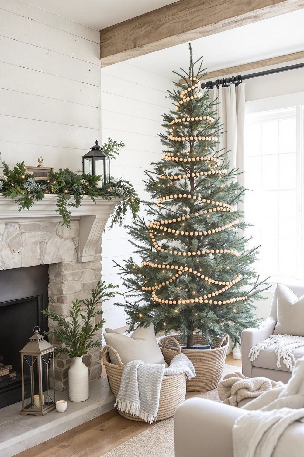 Farmhouse Christmas tree with a neutral woven tree collar, wooden bead garland, and soft cozy holiday decor in a bright living room.