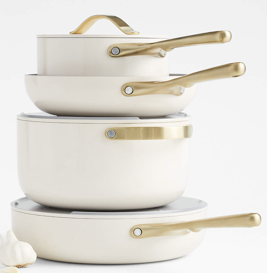 non-toxic ceramic cookware set by Caraway in cream color displayed on kitchen counter