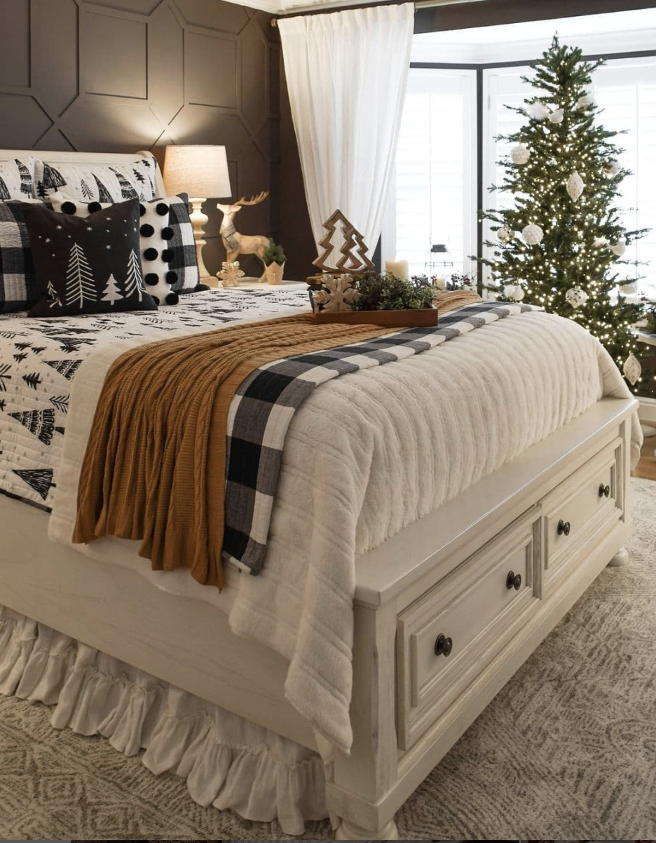 modern farmhouse christmas bedroom with black and white bedding, mustard throw, and simple christmas tree decor