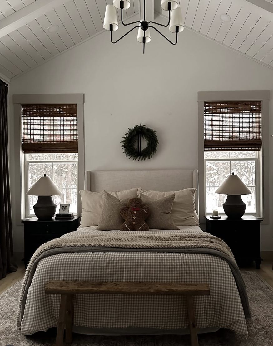 modern farmhouse christmas bedroom with gingham bedding, neutral decor, and gingerbread pillow