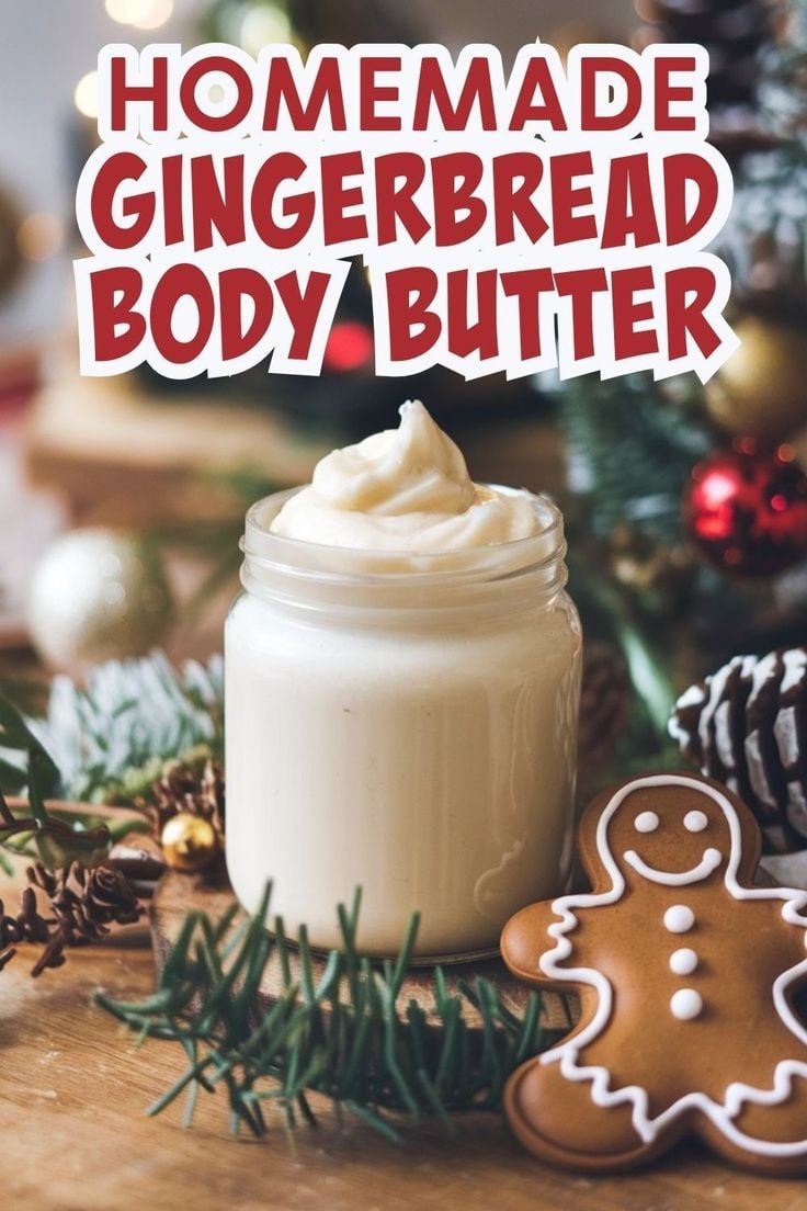 Jar of homemade gingerbread body butter with festive greenery and a gingerbread cookie - a cozy and nourishing homemade homemaker gift idea for Christmas.