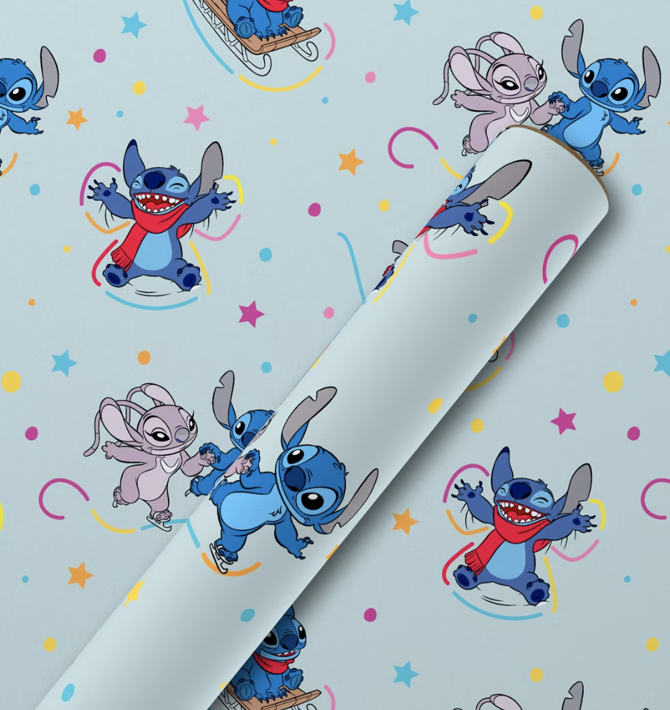 Light blue Lilo & Stitch wrapping paper featuring Stitch and Angel ice skating, sledding, and playing in winter scenes.