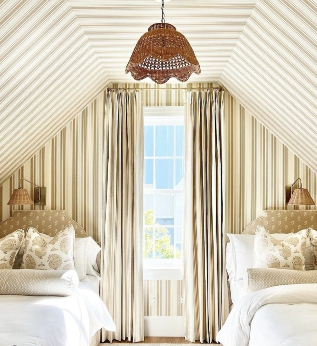 Neutral striped ceiling bedroom with beige and cream stripes on a sloped ceiling and coordinated striped walls.