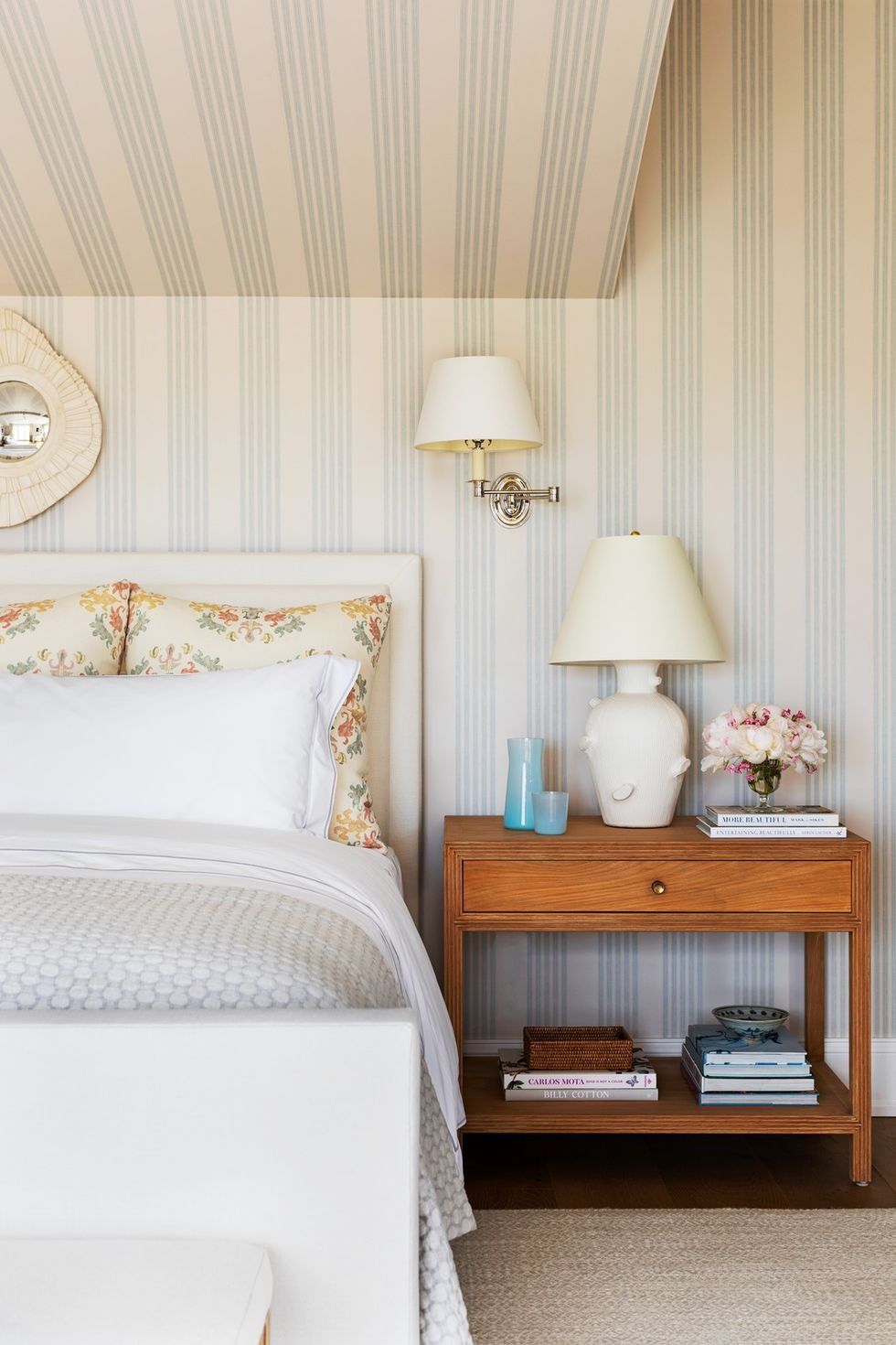 Neutral striped ceiling bedroom featuring soft blue and white stripes on the ceiling and walls with a serene, classic design.