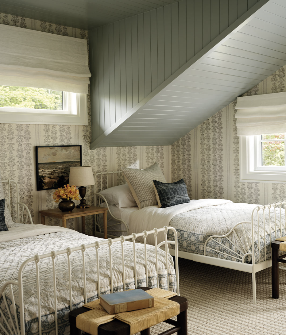 Wooden striped ceiling bedroom with painted wood plank ceiling on a sloped roof and soft, neutral decor.