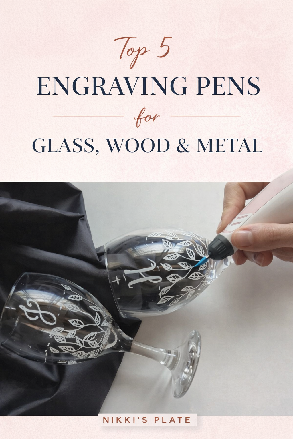 engraving pen personalizing wine glasses with floral design for DIY project