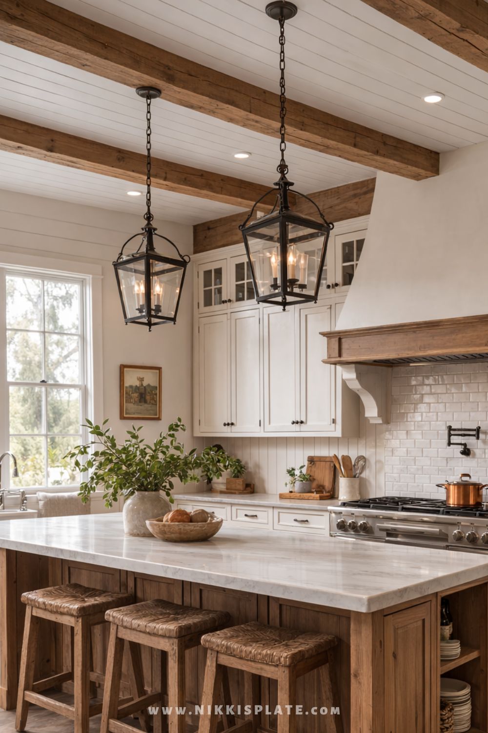 Rustic farmhouse kitchen with wood island, marble countertop overhang seating, lantern pendant lights, shiplap ceiling, and exposed wood beams.