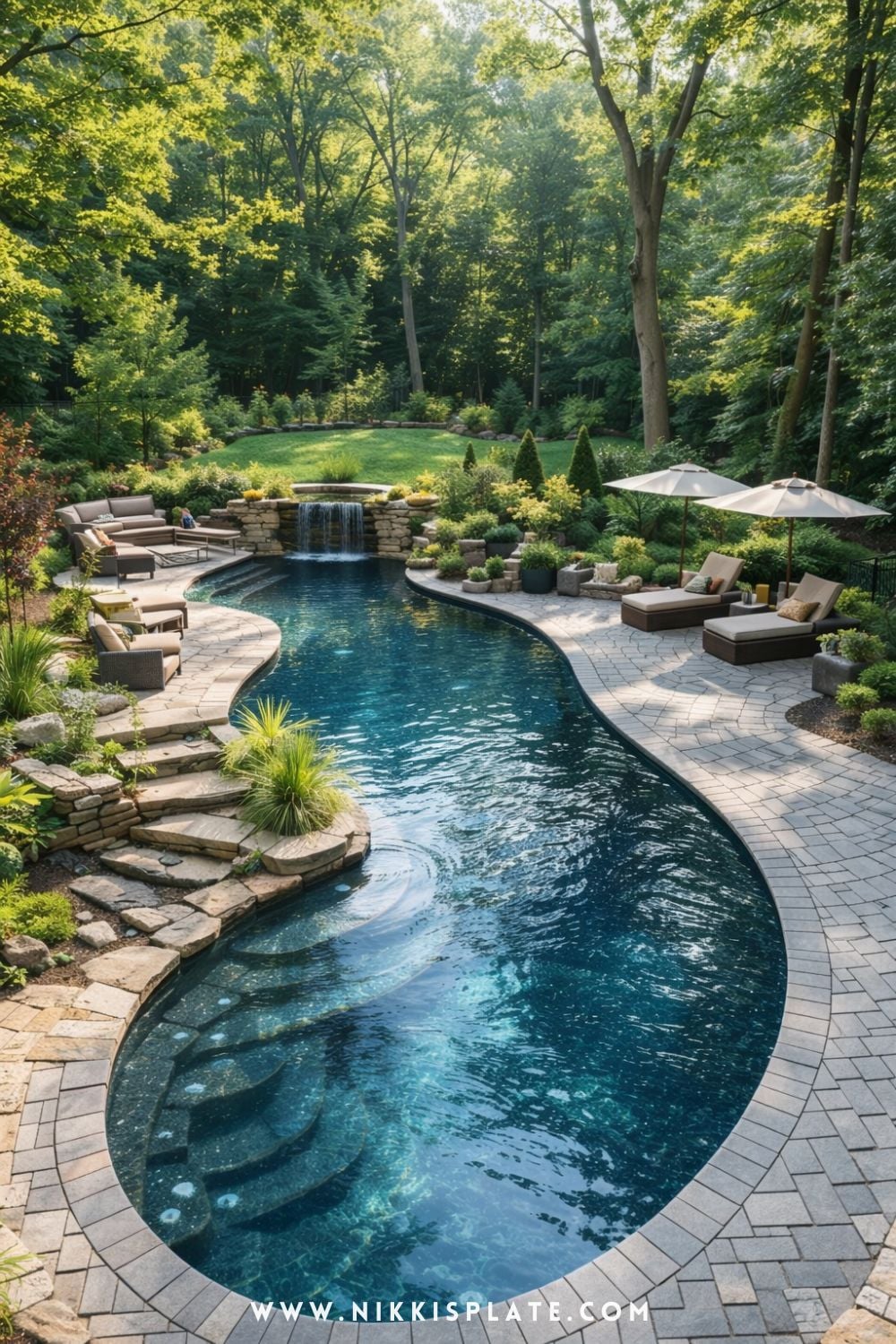 forest inspired natural swimming pool design with curved shape, stone edges, and lush greenery in a wooded backyard