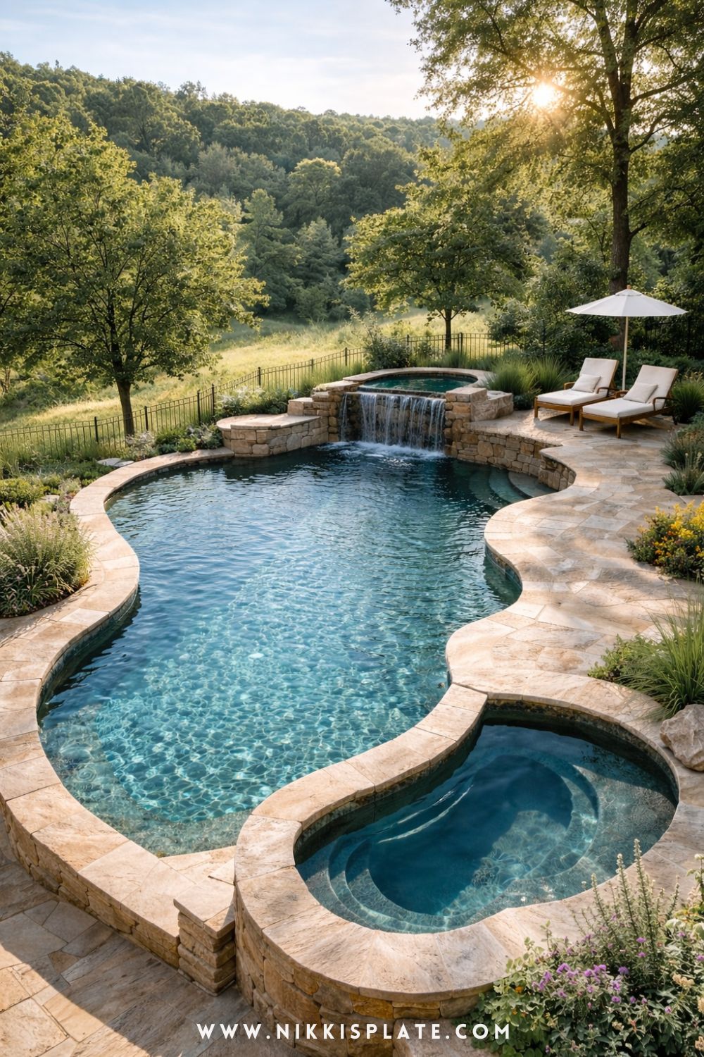 Luxury natural swimming pool backyard oasis with stone edging, built-in spa, and peaceful landscaped surroundings