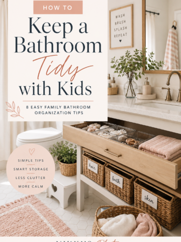 Organized family bathroom with vanity storage, baskets, bath mat, and drawer organizers for keeping a bathroom tidy with kids.