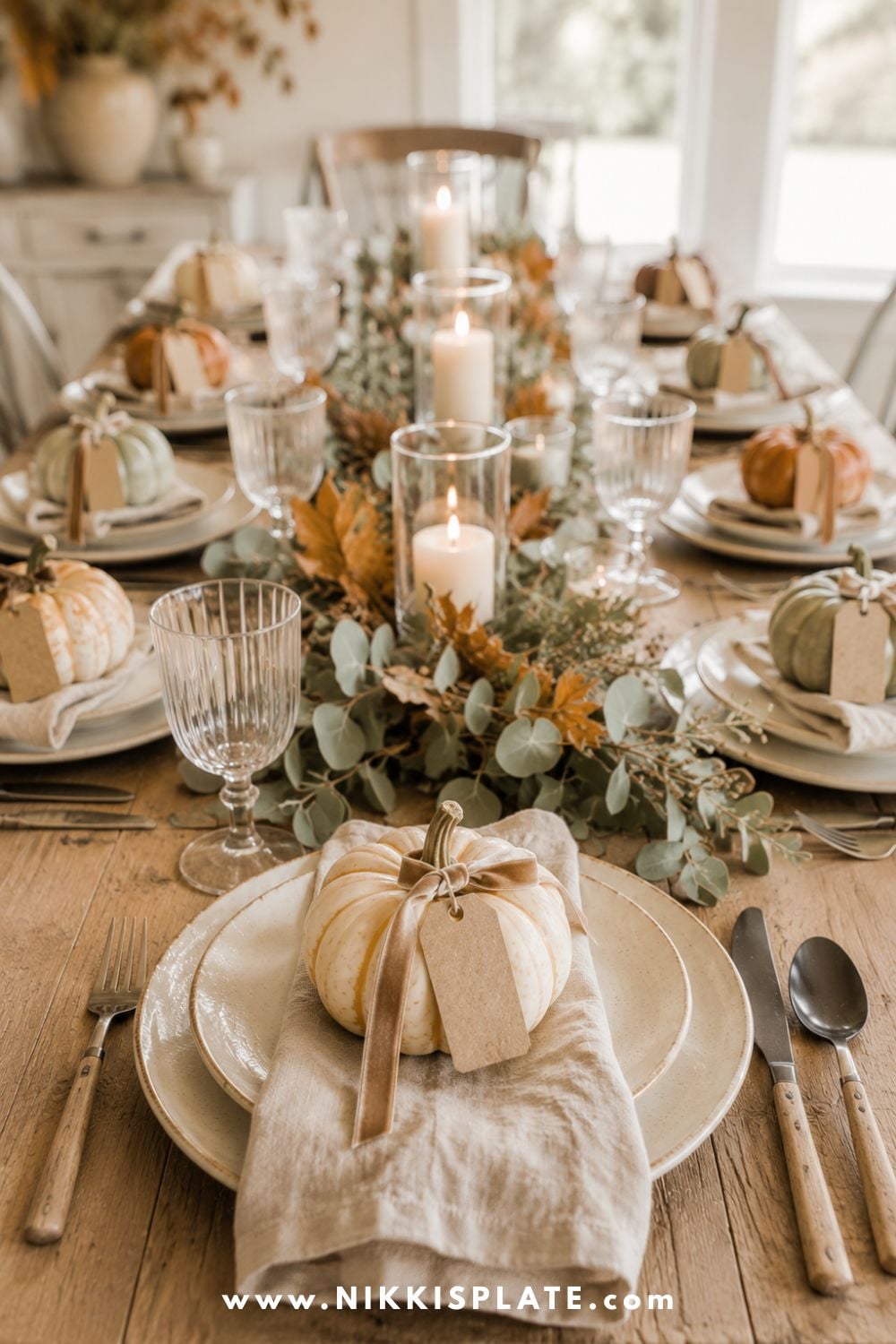 Fall place settings decorated with mini heirloom pumpkins, linen napkins, stoneware plates and woven chargers.