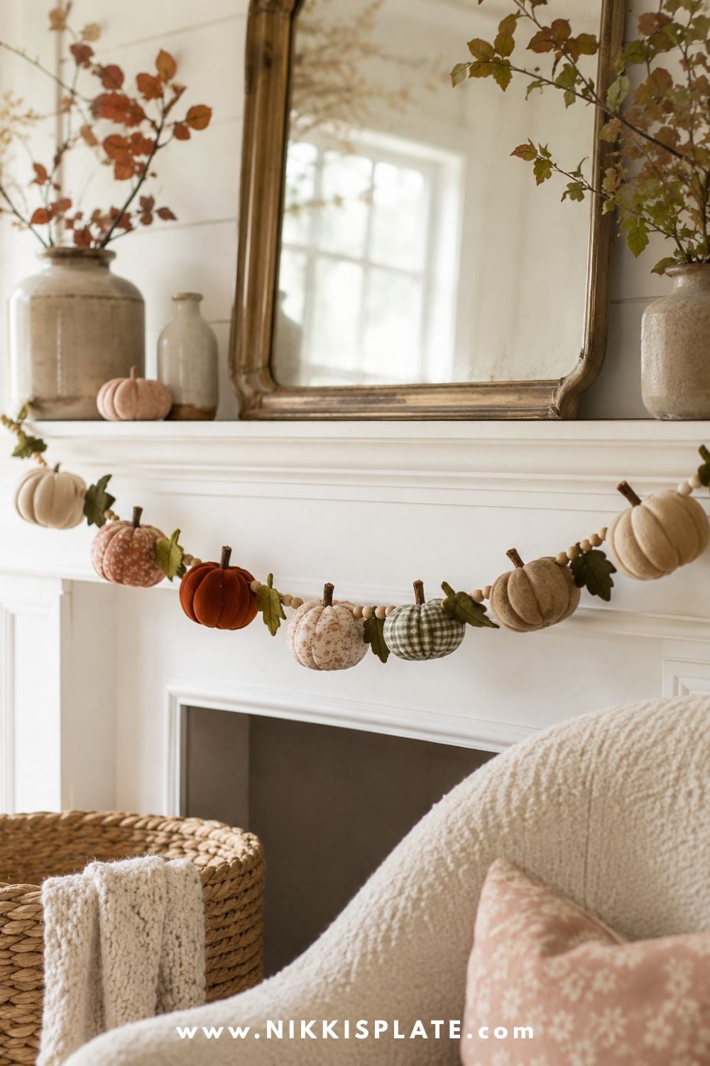 Handmade mini pumpkin garland featuring linen, velvet, floral and gingham pumpkins across a bright farmhouse fireplace mantel.