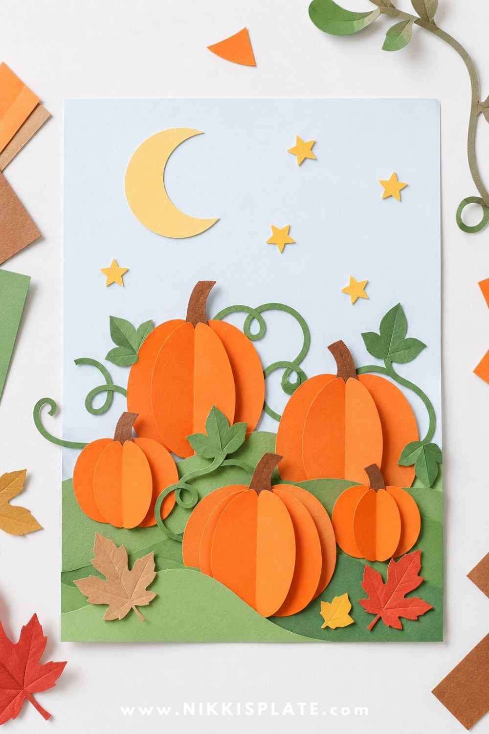 Paper pumpkin patch collage with orange pumpkins, green vines, fall leaves, stars, and moon for a cozy Halloween craft for preschoolers.
