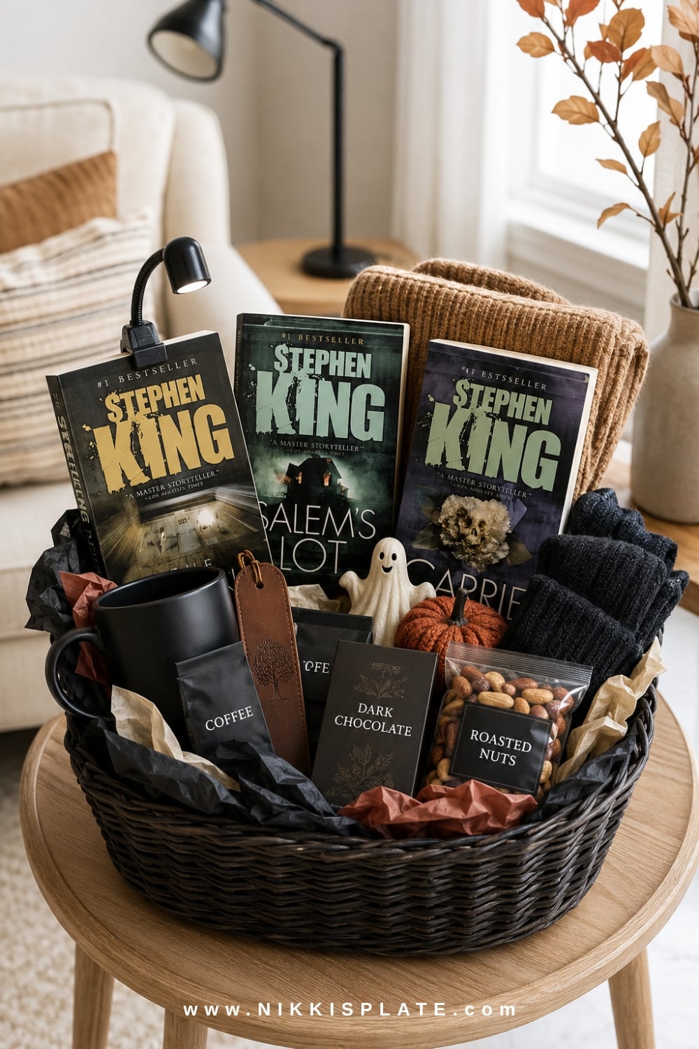 Book lover's spooky basket for him with thrillers, a reading light, bookmark, coffee, chocolate and a blanket.