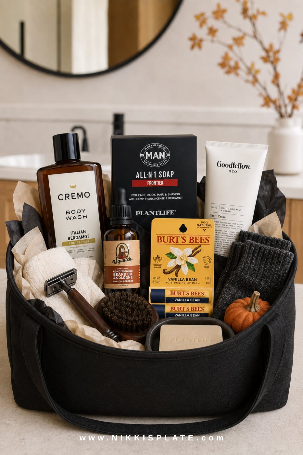Men's grooming boo basket with beard care, body wash, shaving supplies, a black toiletry bag and cozy socks.