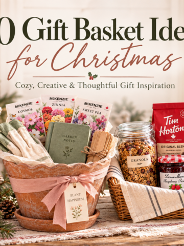 Four Christmas gift baskets with coffee, cosy knitwear, popcorn, and blush ribbon on a pale oak table.